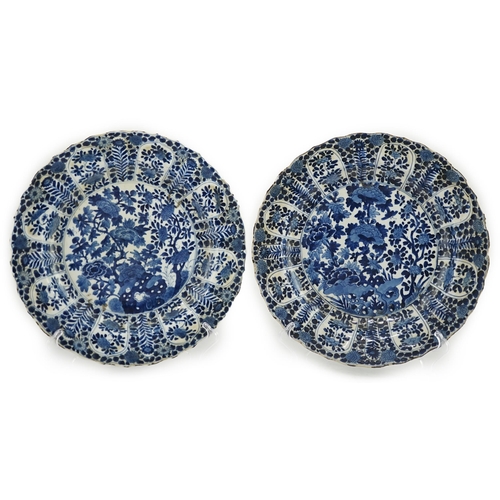 121 - A pair of Chinese blue and white chargers, Kangxi period (1662-1722), each painted to the centre wit... 