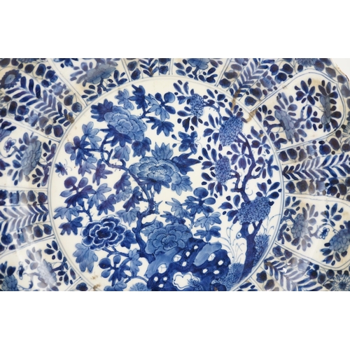 121 - A pair of Chinese blue and white chargers, Kangxi period (1662-1722), each painted to the centre wit... 