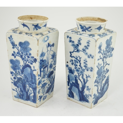 123 - A pair of Chinese blue and white square section vases, Kangxi period, each side variously painted wi... 