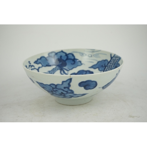 128 - A Chinese blue and white cloud and dragon bowl, Yongzheng mark and period (1723-35), painted to th... 