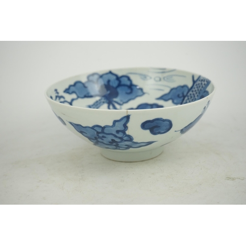 128 - A Chinese blue and white cloud and dragon bowl, Yongzheng mark and period (1723-35), painted to th... 