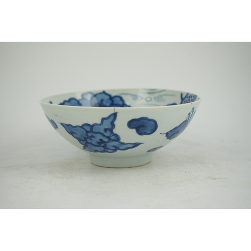 128 - A Chinese blue and white cloud and dragon bowl, Yongzheng mark and period (1723-35), painted to th... 