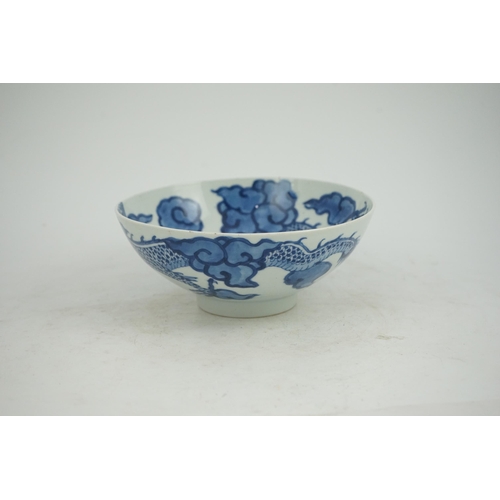 128 - A Chinese blue and white cloud and dragon bowl, Yongzheng mark and period (1723-35), painted to th... 