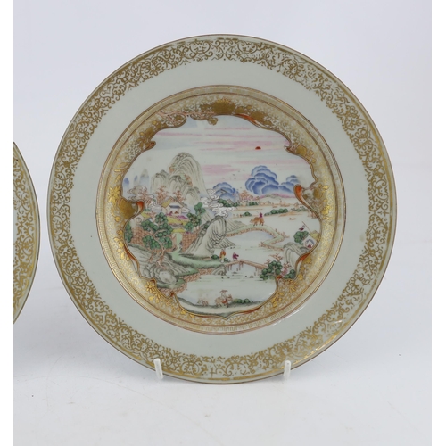 130 - A pair of Chinese famille rose landscape plates, Yongzheng-Qianlong period, each finely painted wi... 