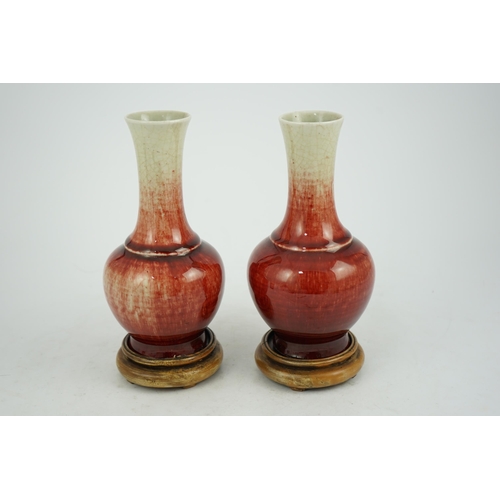 136 - A pair of Chinese Langyao bottle vases, late 18th century, each neck with a mushroom coloured glaze ... 