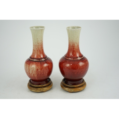 136 - A pair of Chinese Langyao bottle vases, late 18th century, each neck with a mushroom coloured glaze ... 