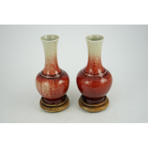 136 - A pair of Chinese Langyao bottle vases, late 18th century, each neck with a mushroom coloured glaze ... 