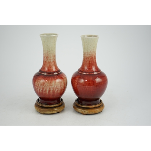 136 - A pair of Chinese Langyao bottle vases, late 18th century, each neck with a mushroom coloured glaze ... 