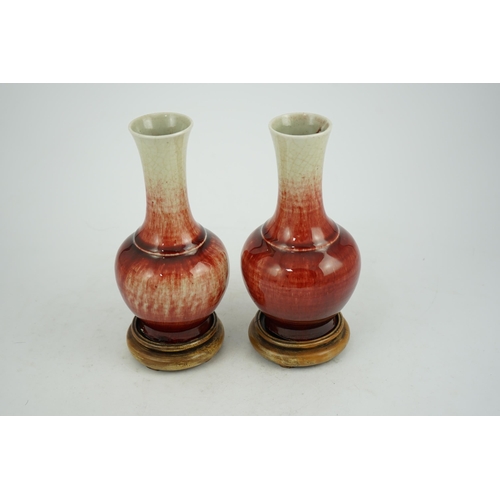 136 - A pair of Chinese Langyao bottle vases, late 18th century, each neck with a mushroom coloured glaze ... 