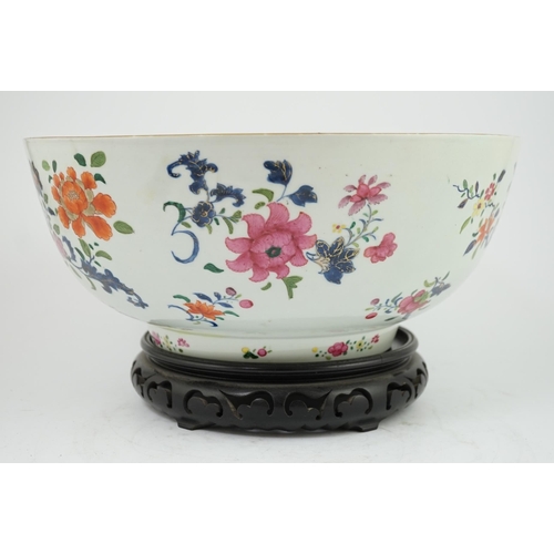 138 - A large Chinese famille rose punch bowl, Qianlong period, the exterior painted with flowers in a fen... 