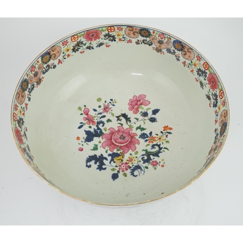 138 - A large Chinese famille rose punch bowl, Qianlong period, the exterior painted with flowers in a fen... 