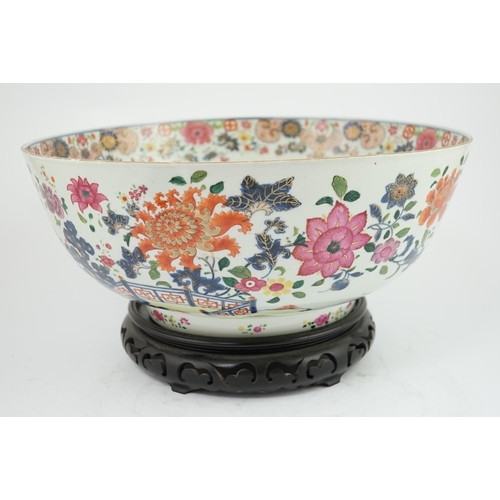 138 - A large Chinese famille rose punch bowl, Qianlong period, the exterior painted with flowers in a fen... 