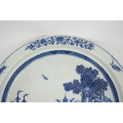 139 - An unusual Chinese European subject blue and white shallow basin, Qianlong period, painted with a ma... 