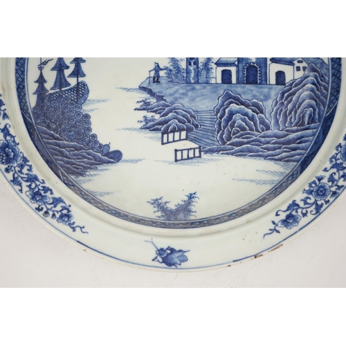 139 - An unusual Chinese European subject blue and white shallow basin, Qianlong period, painted with a ma... 