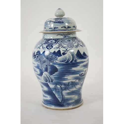 140 - A massive Chinese blue and white temple jar and cover, Qianlong period, painted with a temple pago... 