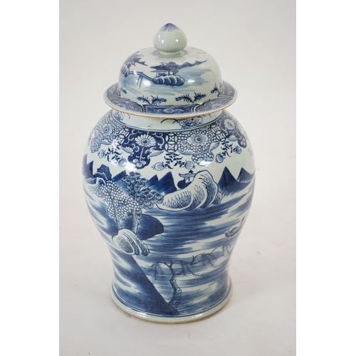 140 - A massive Chinese blue and white temple jar and cover, Qianlong period, painted with a temple pago... 