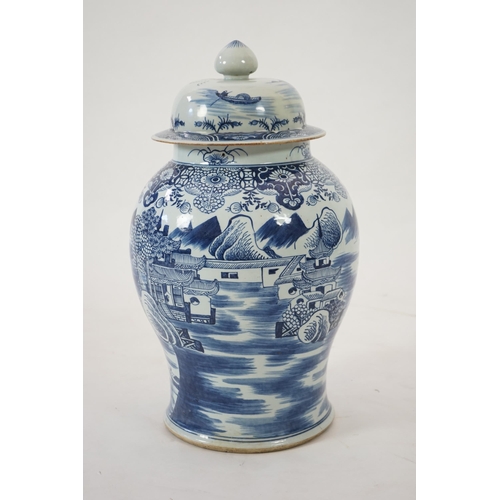 140 - A massive Chinese blue and white temple jar and cover, Qianlong period, painted with a temple pago... 