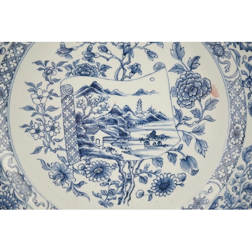 141 - A Chinese blue and white 'scroll and blossom' charger, Qianlong period, the centre painted with a la... 