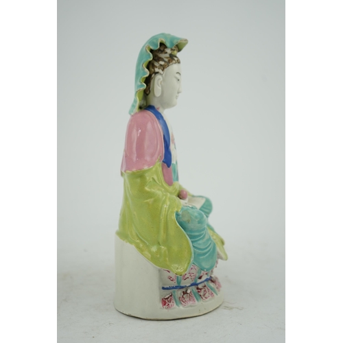 146 - A Chinese Dehua polychrome enamelled blanc de chine figure of Guanyin, late 18th century, seated on ... 