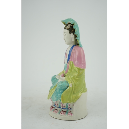 146 - A Chinese Dehua polychrome enamelled blanc de chine figure of Guanyin, late 18th century, seated on ... 