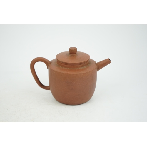 147 - A Chinese Yixing pottery teapot, 18th century, of cylindrical form with a slightly domed cover, inci... 