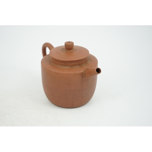 147 - A Chinese Yixing pottery teapot, 18th century, of cylindrical form with a slightly domed cover, inci... 