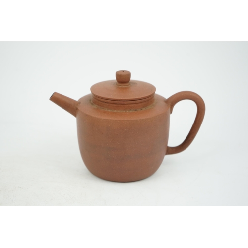 147 - A Chinese Yixing pottery teapot, 18th century, of cylindrical form with a slightly domed cover, inci... 