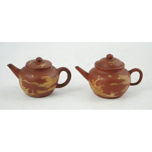 148 - Two Chinese Yixing slip-decorated miniature teapots and covers, 18th/19th century, each decorated in... 