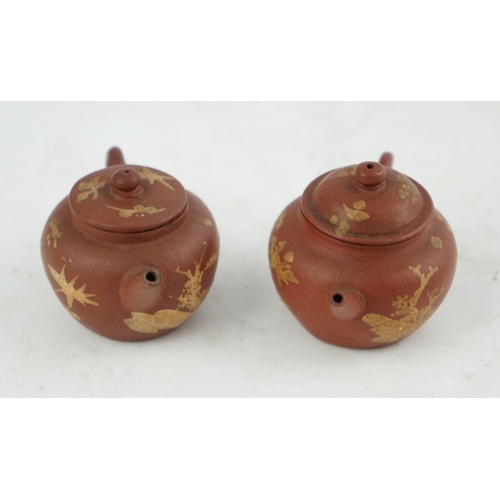 148 - Two Chinese Yixing slip-decorated miniature teapots and covers, 18th/19th century, each decorated in... 