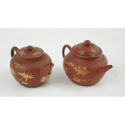 148 - Two Chinese Yixing slip-decorated miniature teapots and covers, 18th/19th century, each decorated in... 