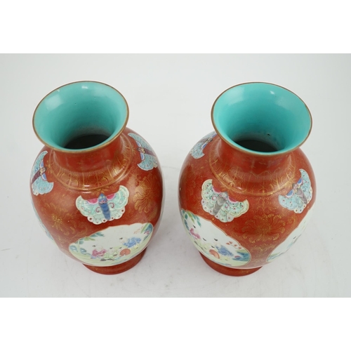 150 - A pair of Chinese coral ground boys vases, Jiaqing period (1796-1820), painted with boys playing i... 