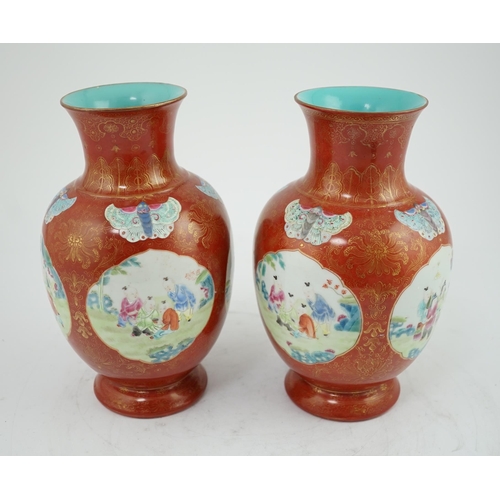 150 - A pair of Chinese coral ground boys vases, Jiaqing period (1796-1820), painted with boys playing i... 