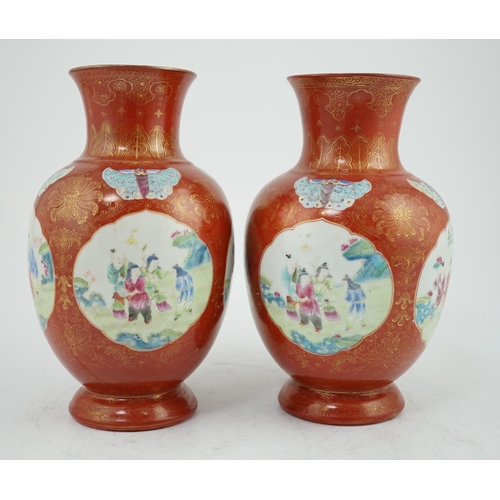 150 - A pair of Chinese coral ground boys vases, Jiaqing period (1796-1820), painted with boys playing i... 