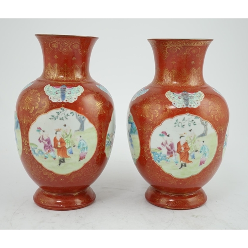 150 - A pair of Chinese coral ground boys vases, Jiaqing period (1796-1820), painted with boys playing i... 