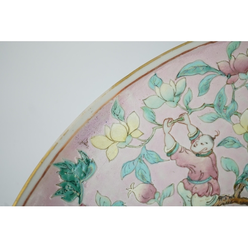 158 - A Chinese enamelled porcelain pink ground boys dish, mid 19th century, painted with five boys clam... 