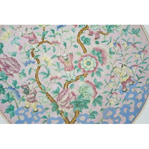 158 - A Chinese enamelled porcelain pink ground boys dish, mid 19th century, painted with five boys clam... 