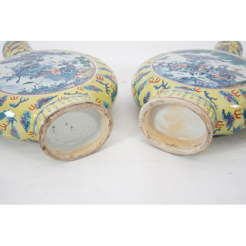 161 - A pair of impressive Chinese yellow ground moonflasks, late 19th century, each painted in underglaze... 