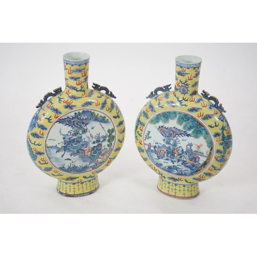 161 - A pair of impressive Chinese yellow ground moonflasks, late 19th century, each painted in underglaze... 