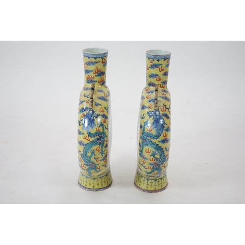 161 - A pair of impressive Chinese yellow ground moonflasks, late 19th century, each painted in underglaze... 