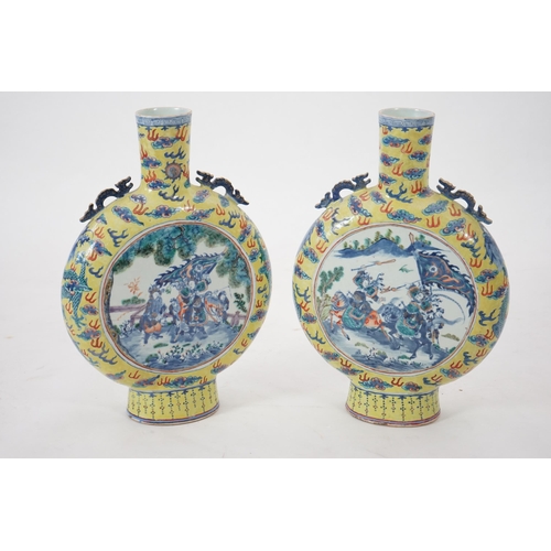 161 - A pair of impressive Chinese yellow ground moonflasks, late 19th century, each painted in underglaze... 