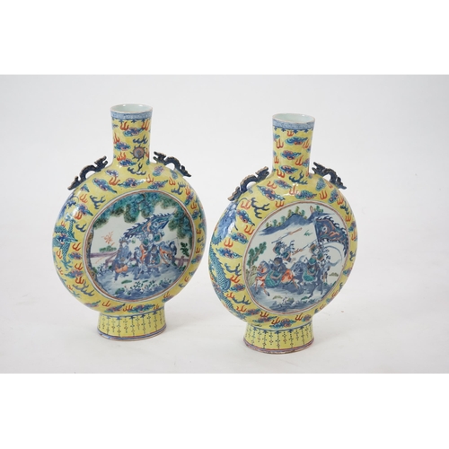 161 - A pair of impressive Chinese yellow ground moonflasks, late 19th century, each painted in underglaze... 