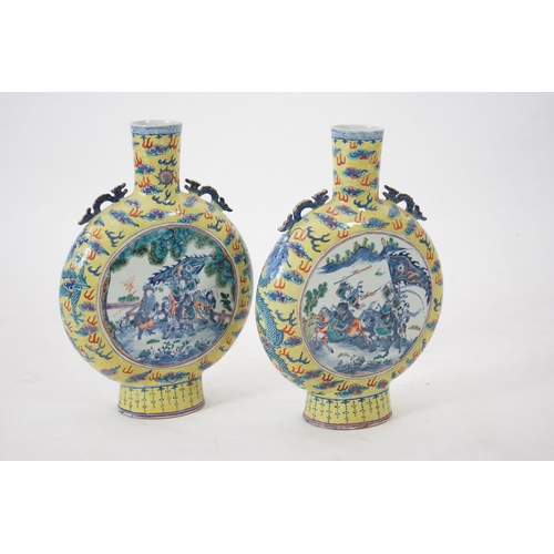 161 - A pair of impressive Chinese yellow ground moonflasks, late 19th century, each painted in underglaze... 