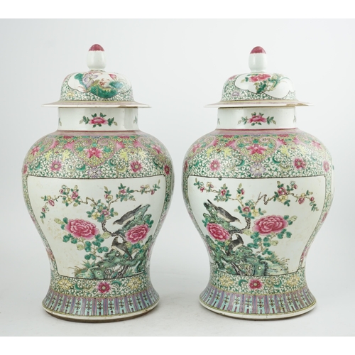 162 - A pair of large Chinese famille rose baluster jars and covers, Qianlong seal mark, but late 19th cen... 