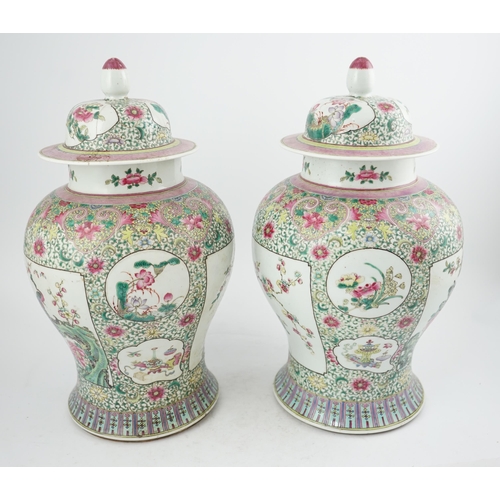 162 - A pair of large Chinese famille rose baluster jars and covers, Qianlong seal mark, but late 19th cen... 