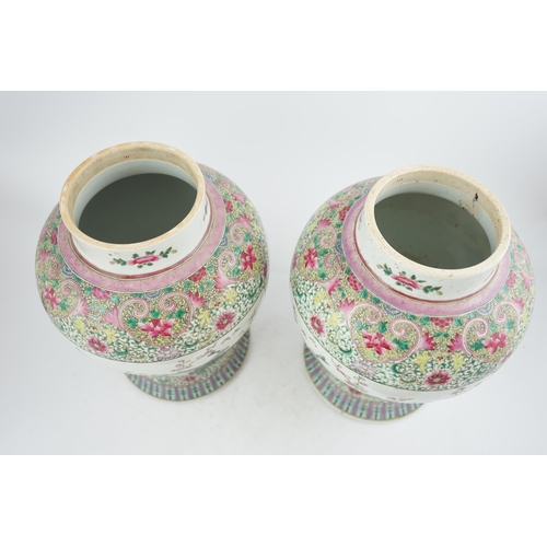 162 - A pair of large Chinese famille rose baluster jars and covers, Qianlong seal mark, but late 19th cen... 