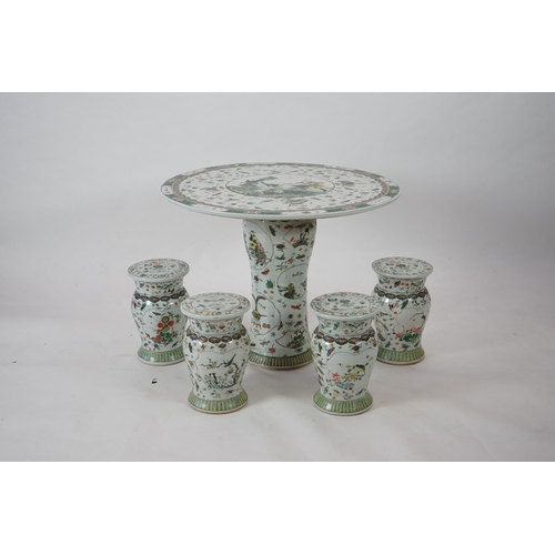 164 - CORRECTION LATE 20th century, A large Chinese famille verte pedestal table and four matching stools,... 