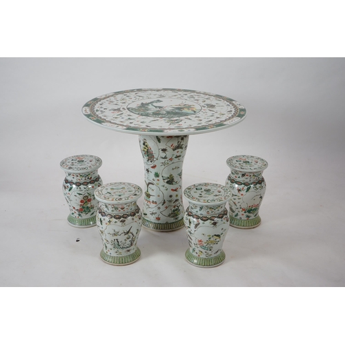 164 - CORRECTION LATE 20th century, A large Chinese famille verte pedestal table and four matching stools,... 