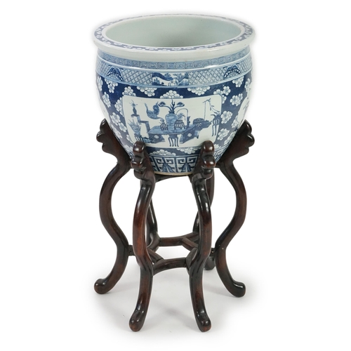 165 - A large Chinese blue and white Hundred Antiques jardinere and hongmu stand, late 19th/early 20th c... 