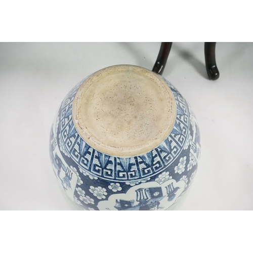 165 - A large Chinese blue and white Hundred Antiques jardinere and hongmu stand, late 19th/early 20th c... 