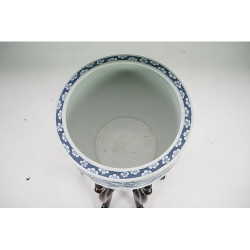 165 - A large Chinese blue and white Hundred Antiques jardinere and hongmu stand, late 19th/early 20th c... 